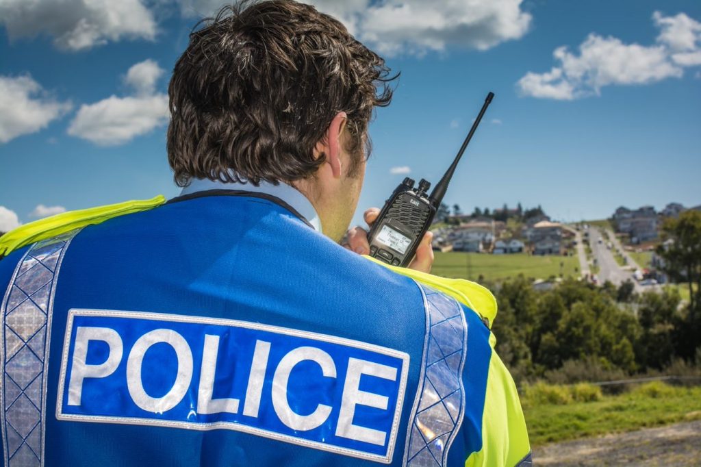 Tait TP8 analogue portable radio in use by New Zealand police