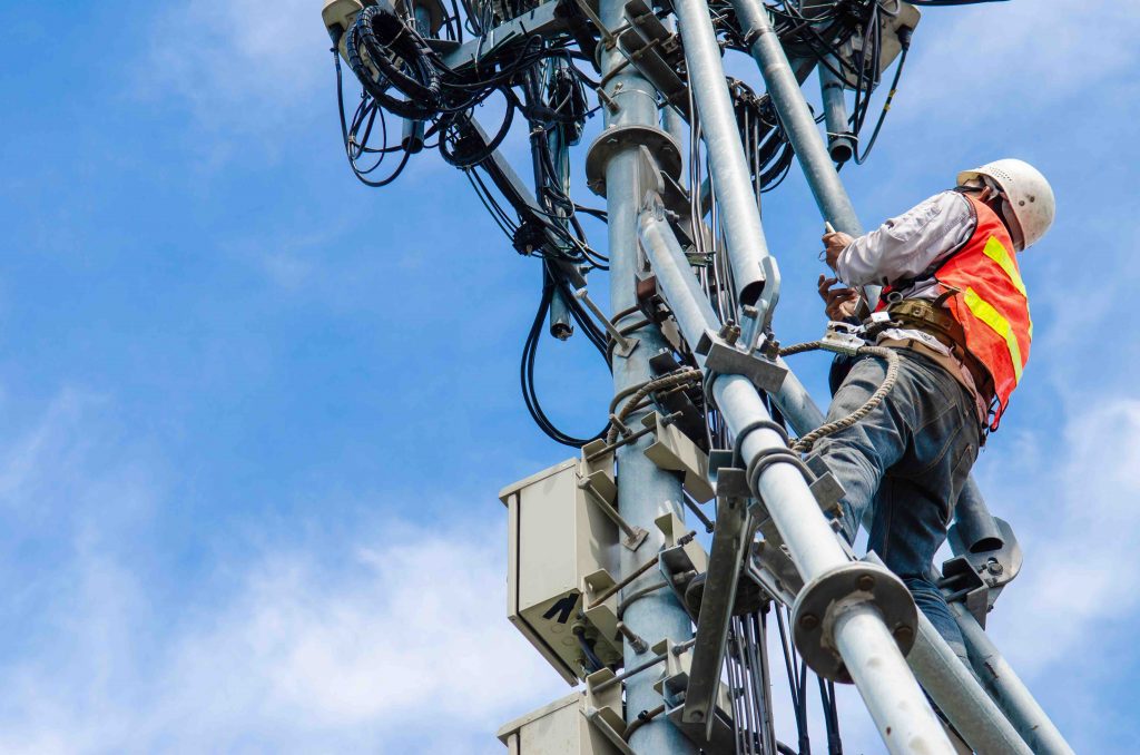 Radio engineer installing antenna system