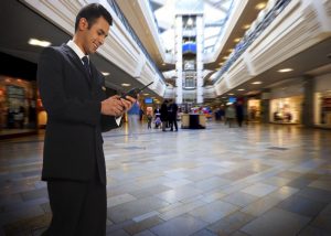 Hytera PD565 DMR walkie talkie in use at a shopping mall